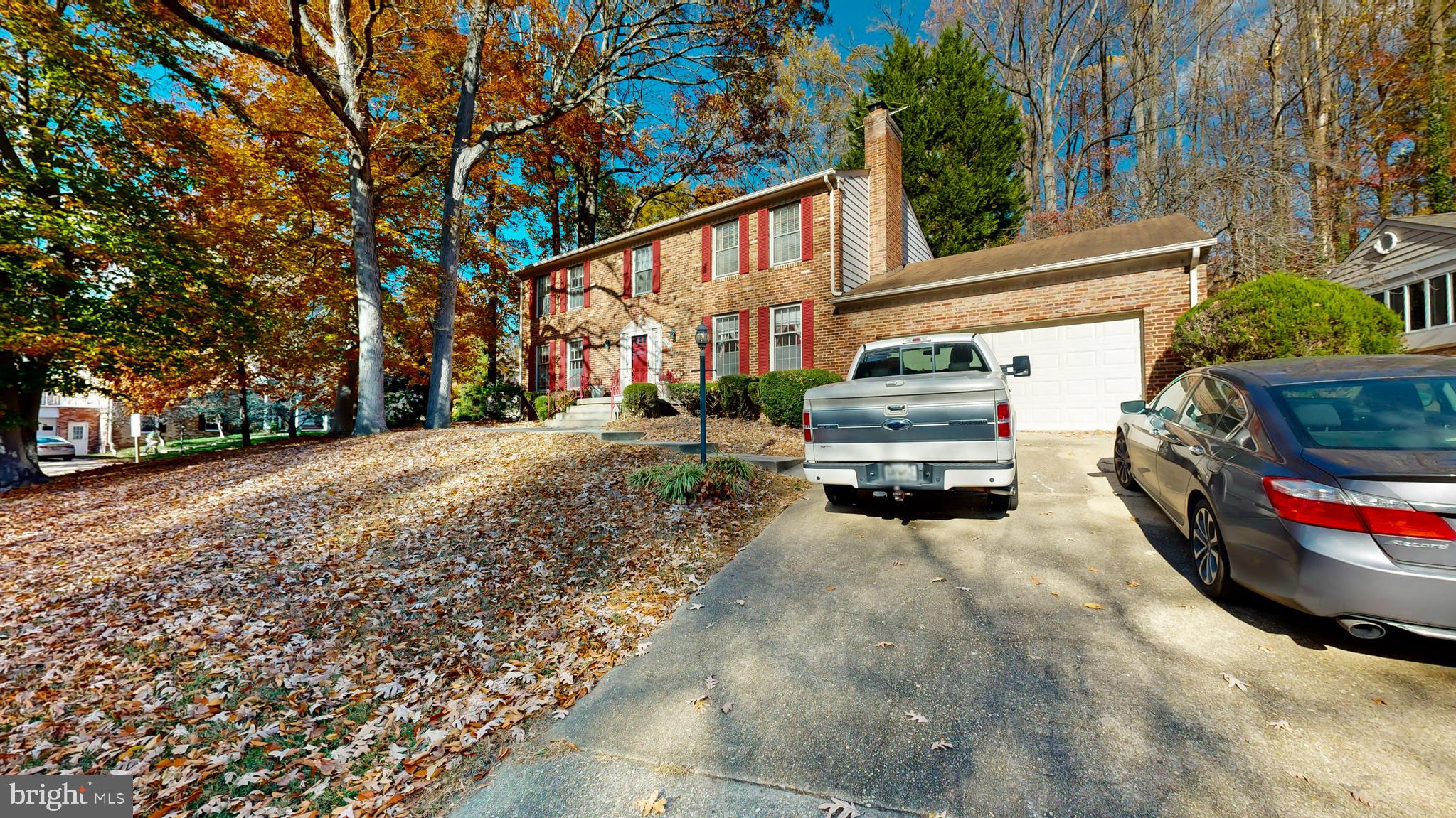 a view of a car parked in front of a house