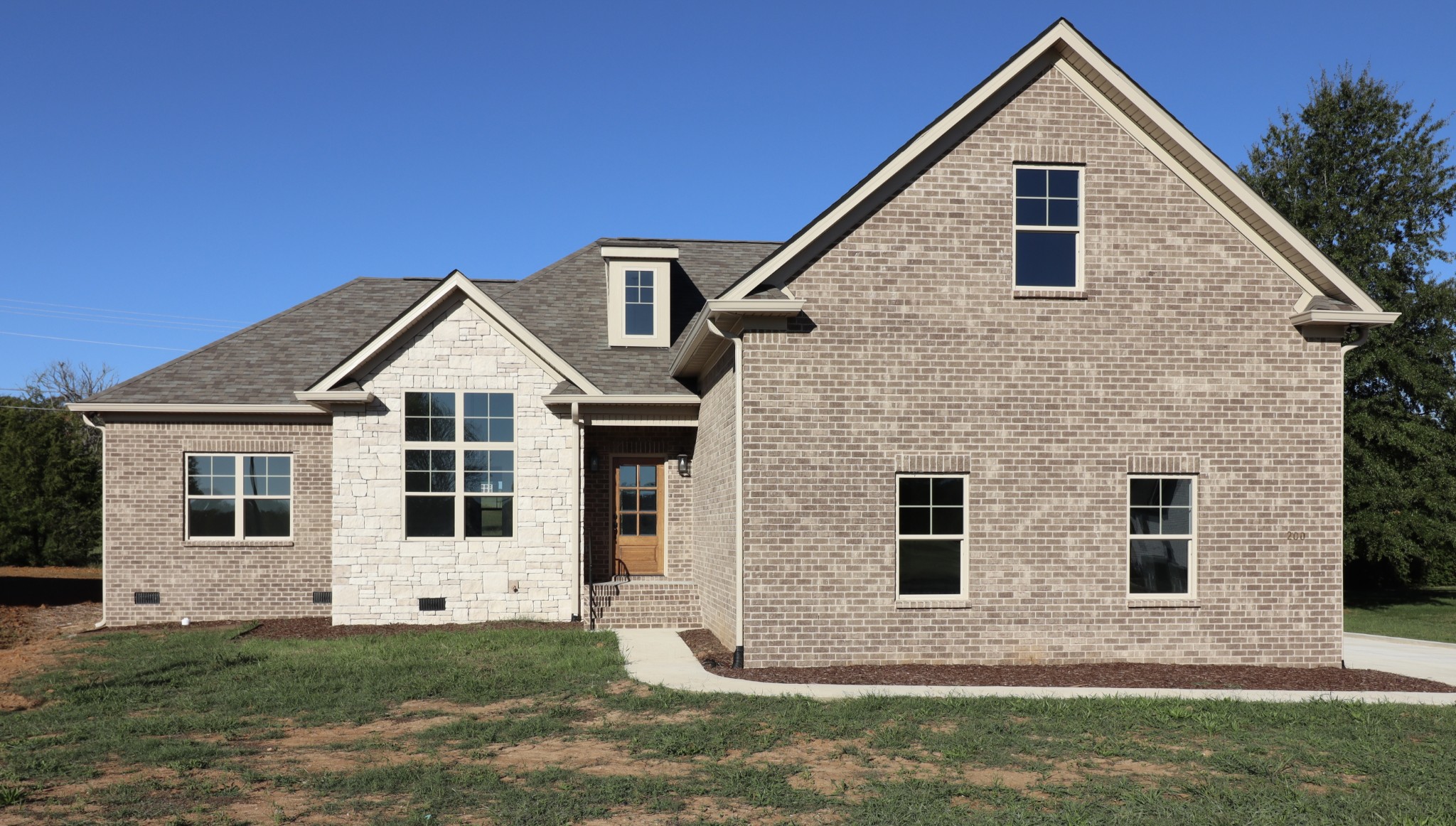 200 Creekside Dr is complete and move-in ready! Yard and landscape will be installed when the weather cools off