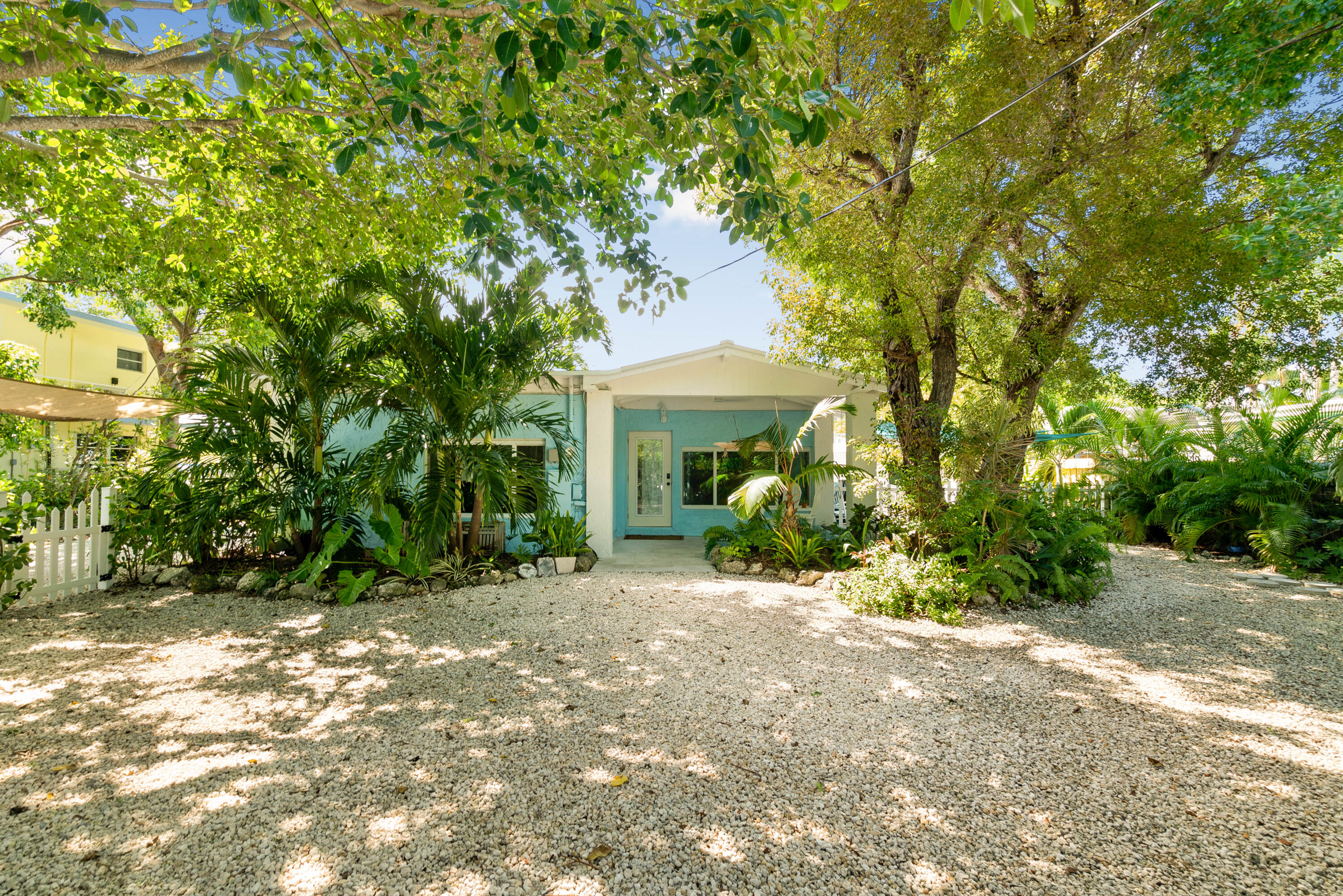 a view of a house with a tree in a yard