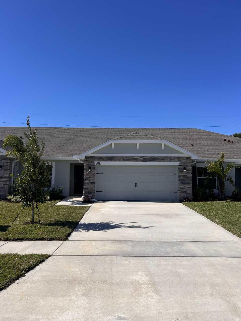 a view of house with yard