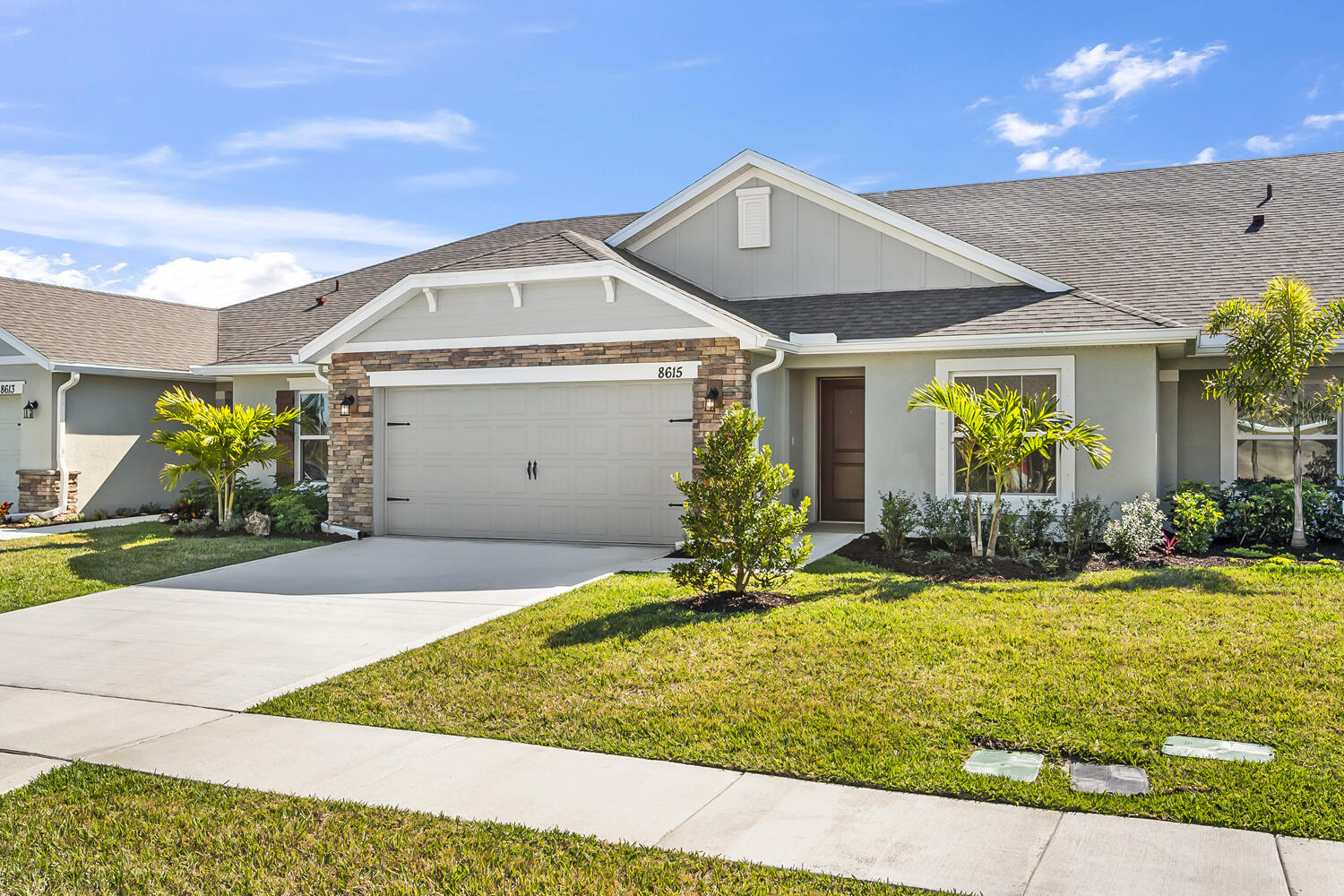 a front view of house with yard and outdoor seating