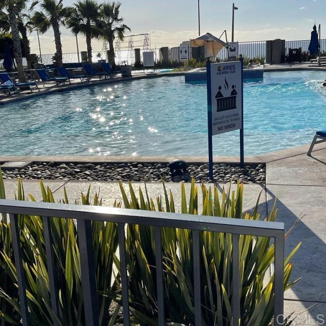 a view of swimming pool from a balcony