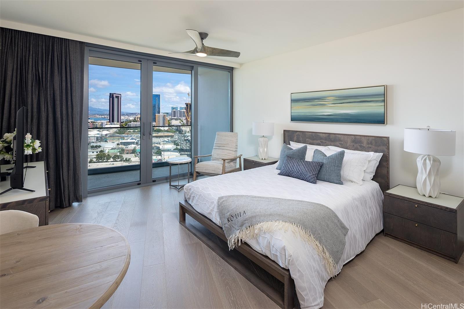 a large bed sitting in a bedroom next to a window