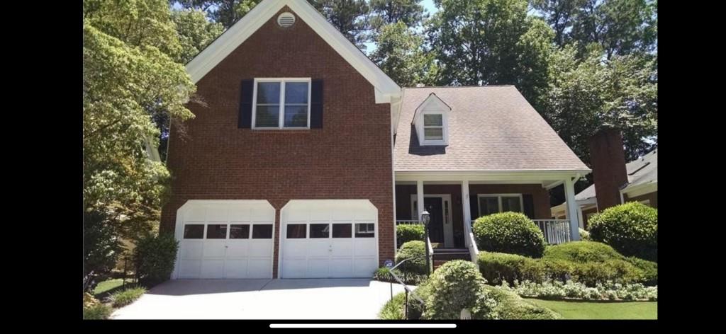 a view of house with yard and entertaining space