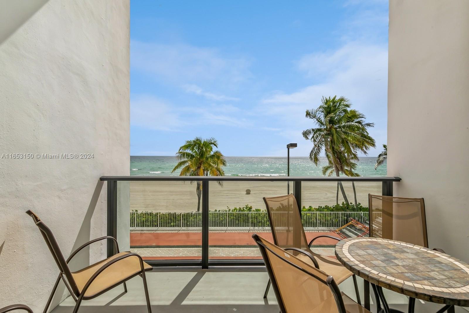 a view of a chairs and table in patio