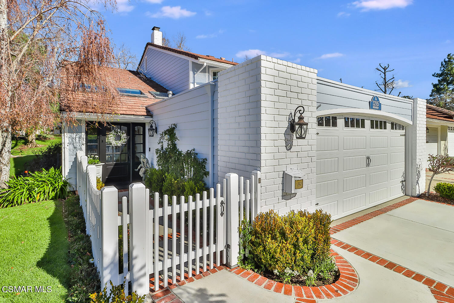 a house view with a garden space