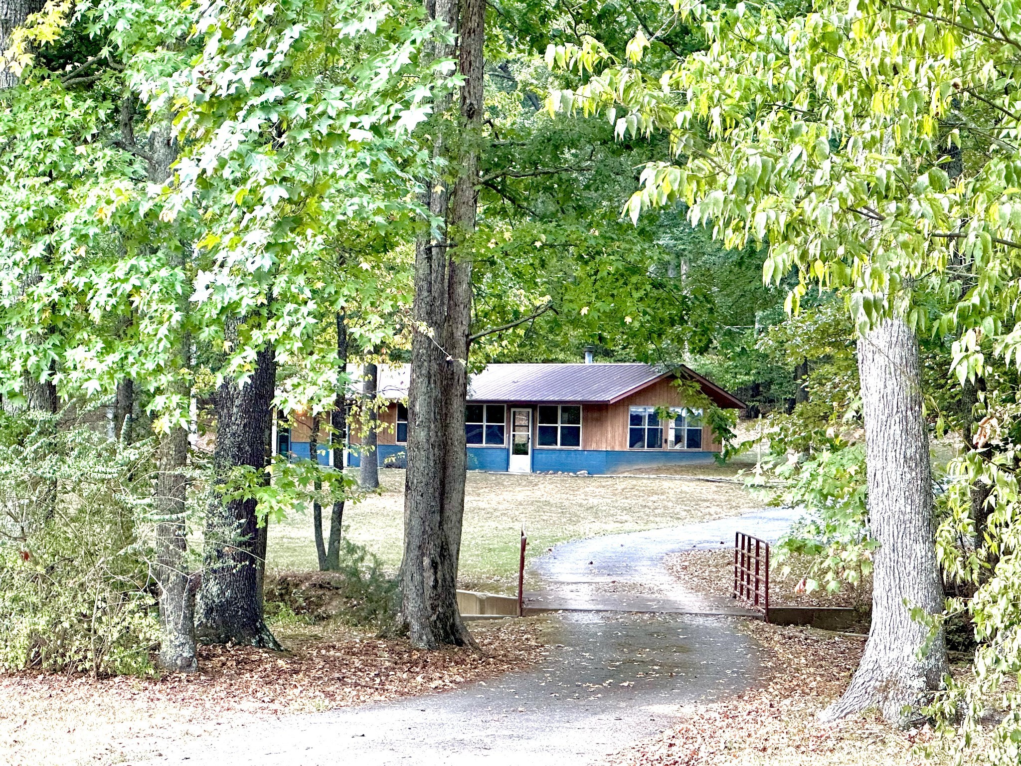 a view of a house with a tree in the background