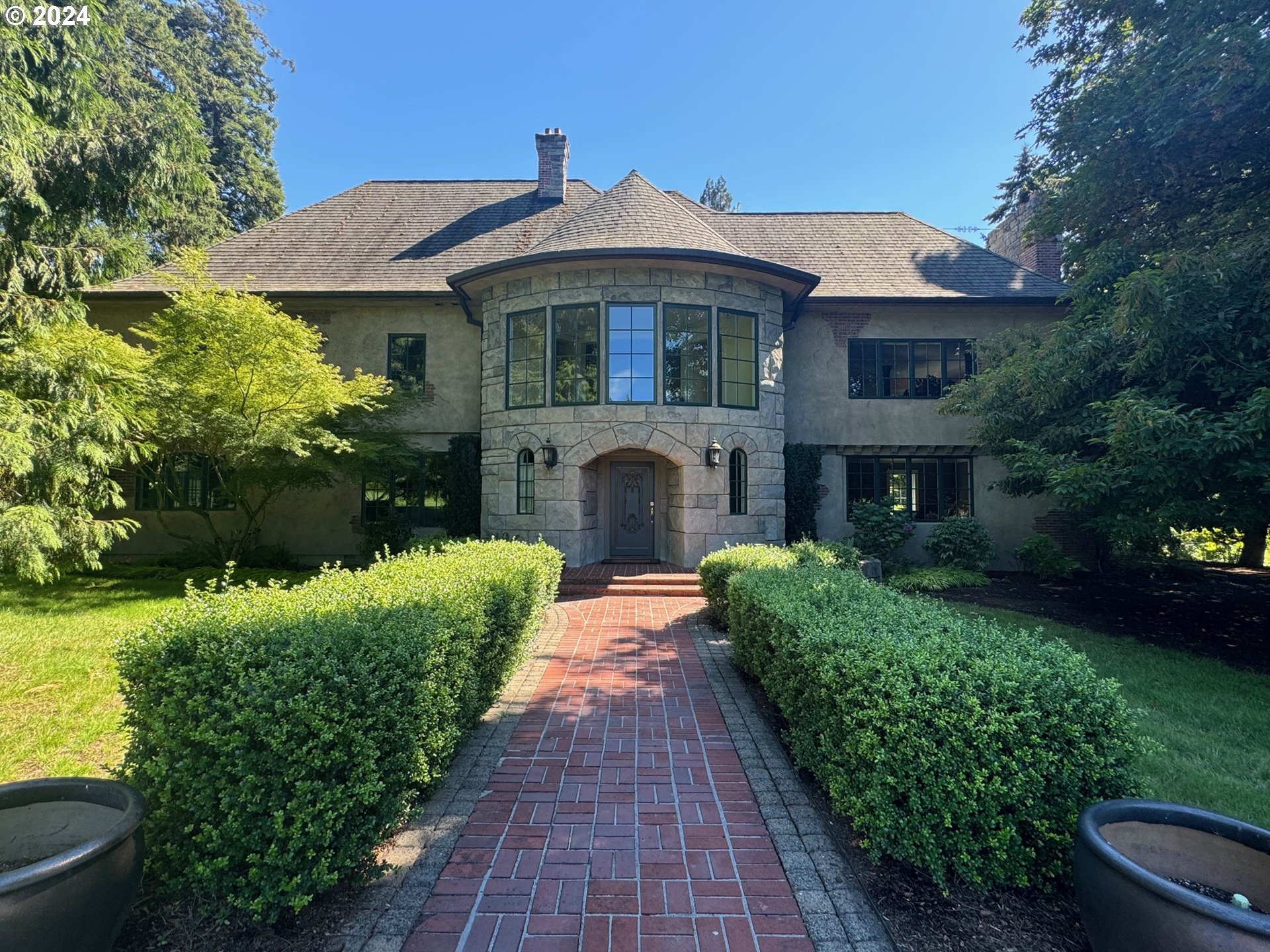 a front view of a house with garden