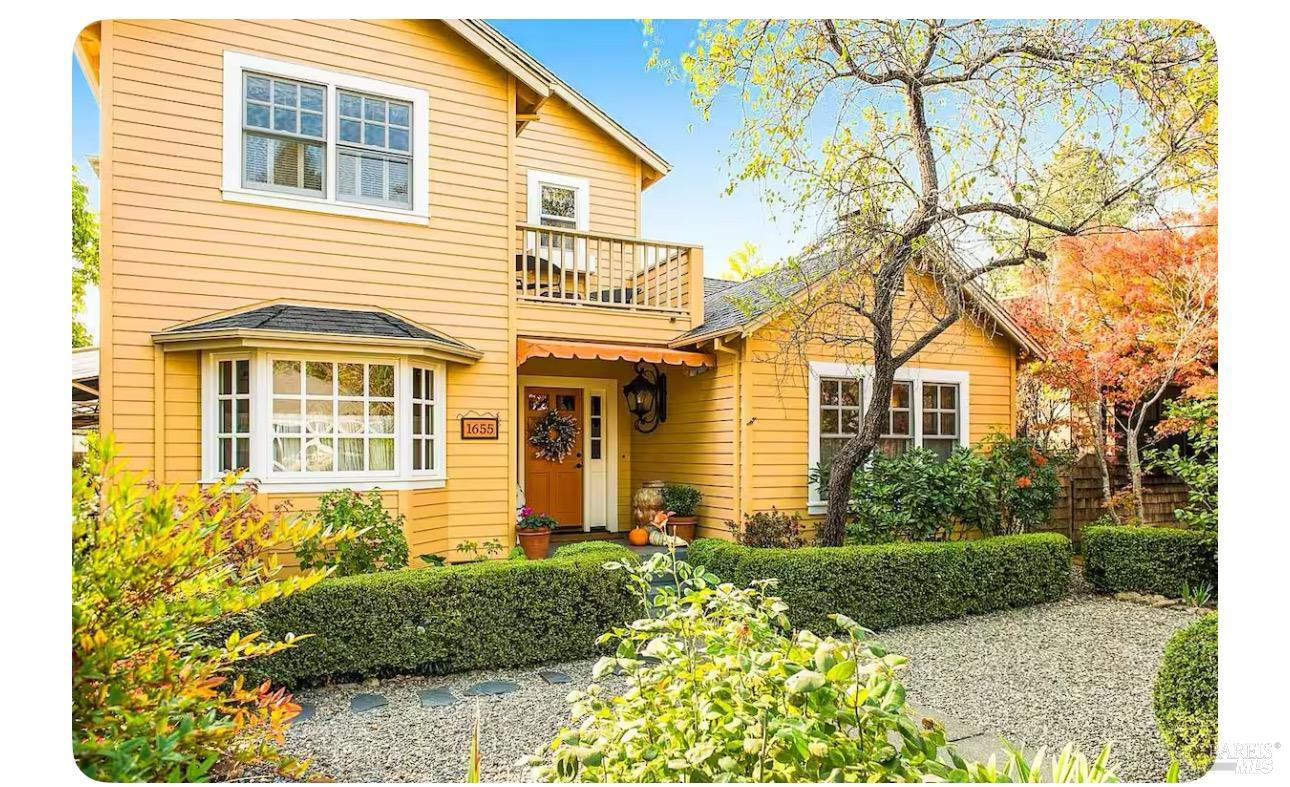 a front view of a house with garden