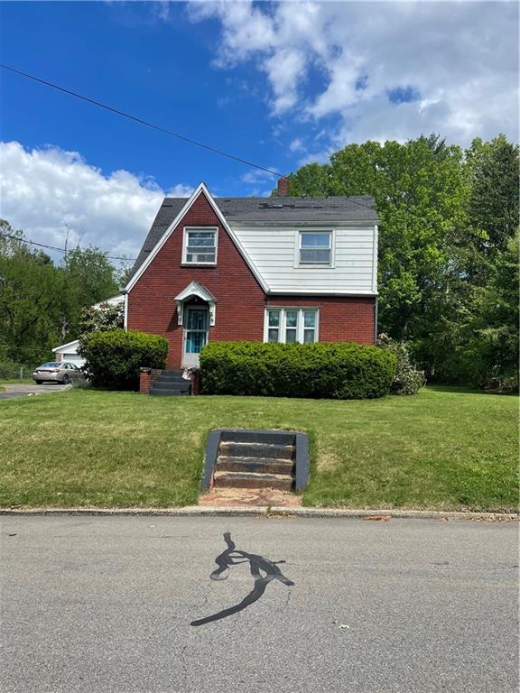 a front view of a house with a yard