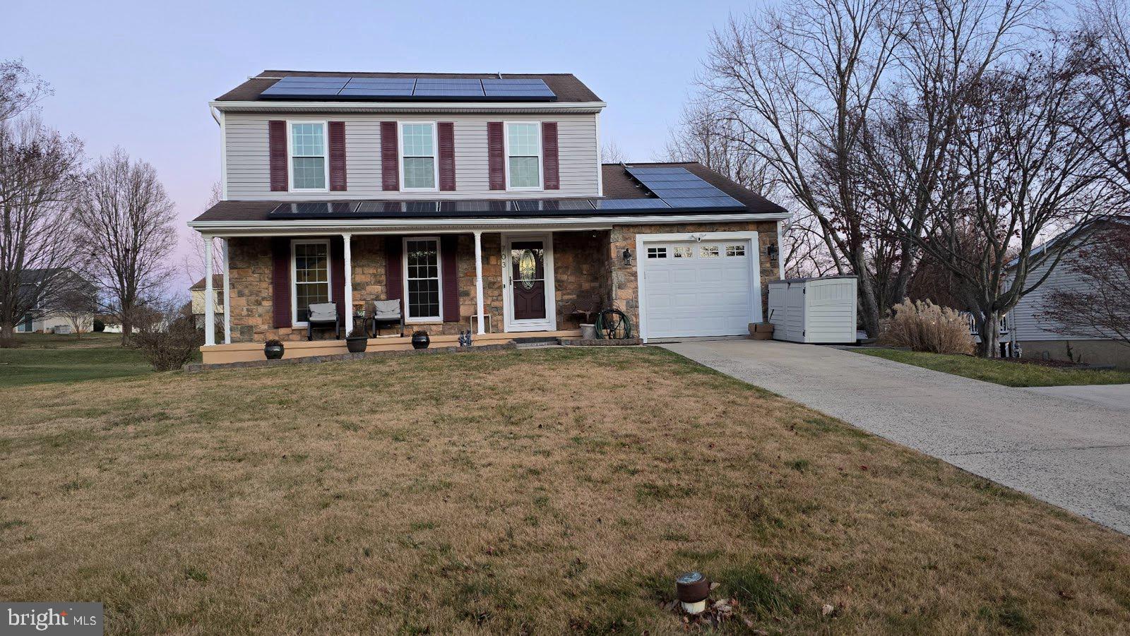 a front view of a house with parking yard