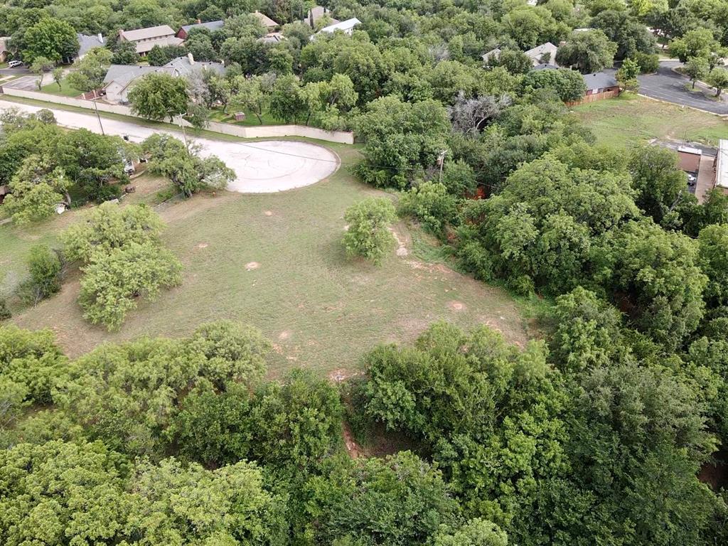 an aerial view of a houses with yard