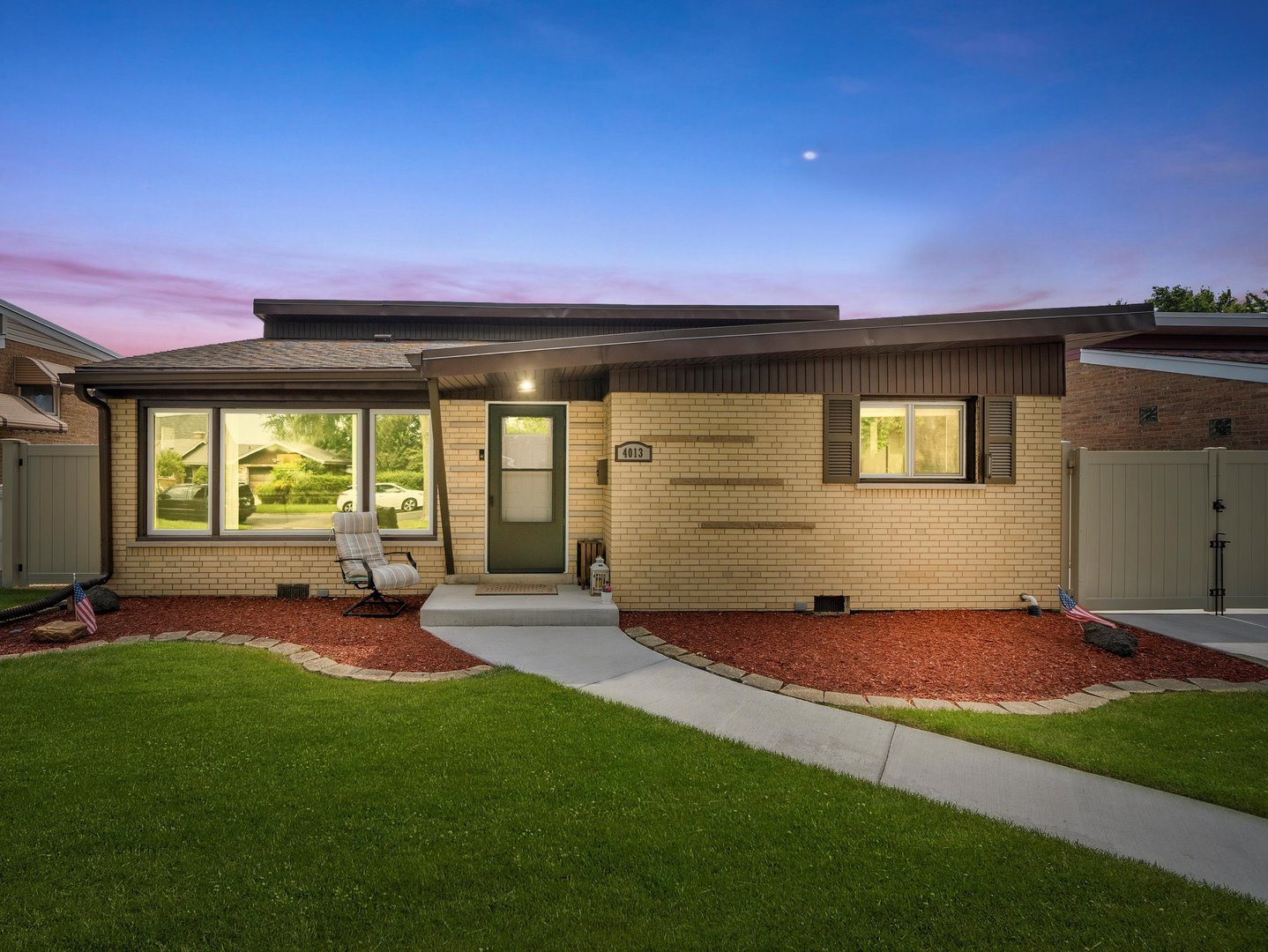 a very nice looking house with a big yard