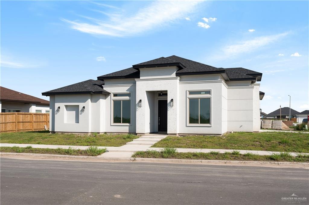 Prairie-style house with a front lawn