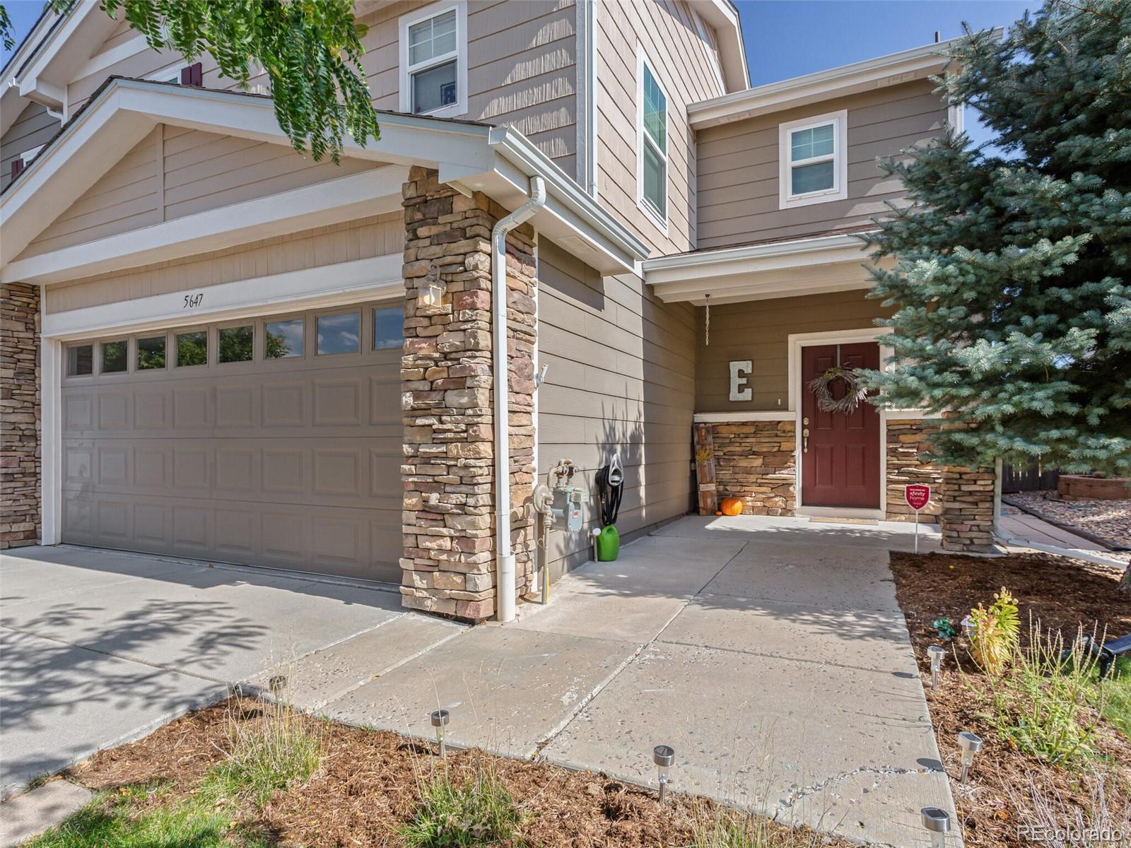 a front view of a house with a garage