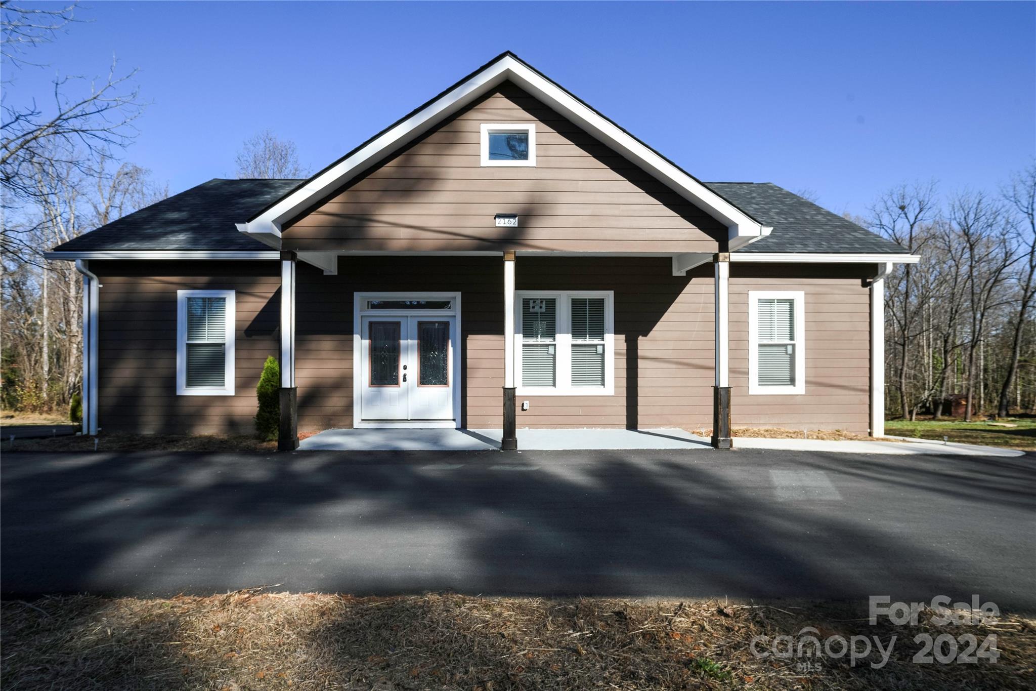 a front view of a house with a garage