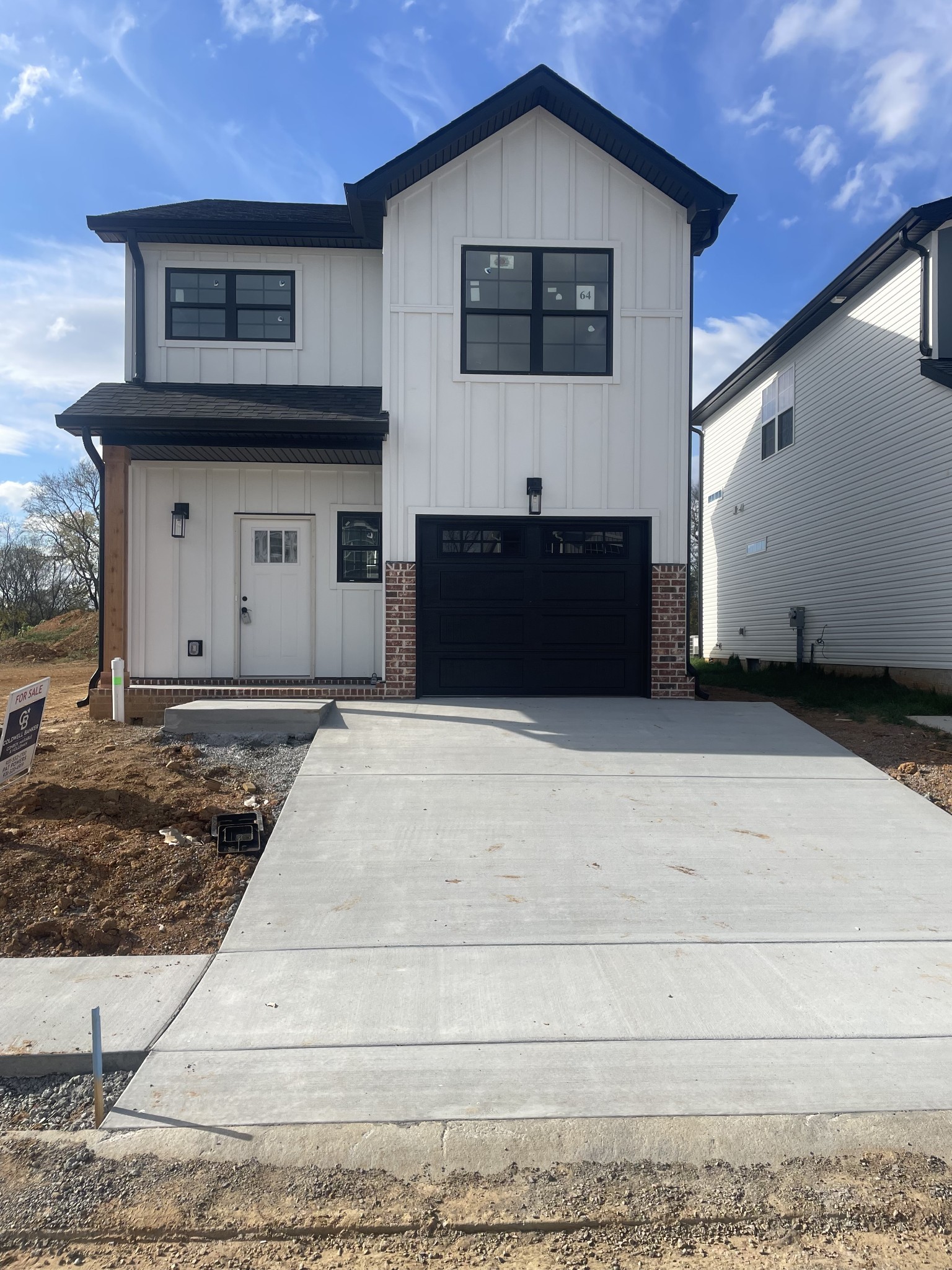 a front view of a house with garage