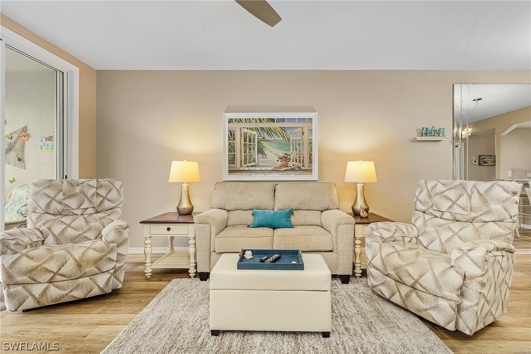 a living room with furniture and a lamp