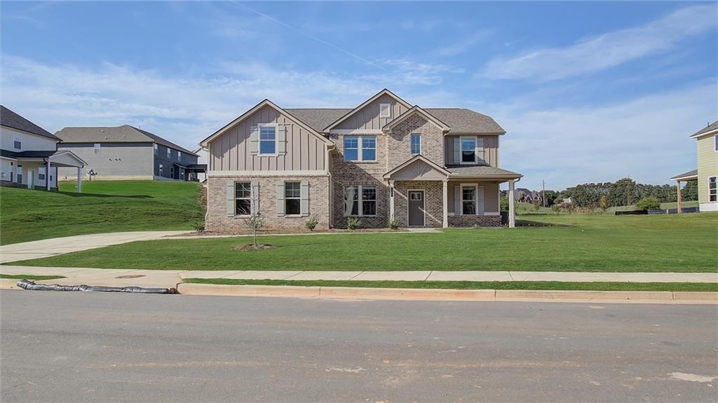 a front view of a house with a yard