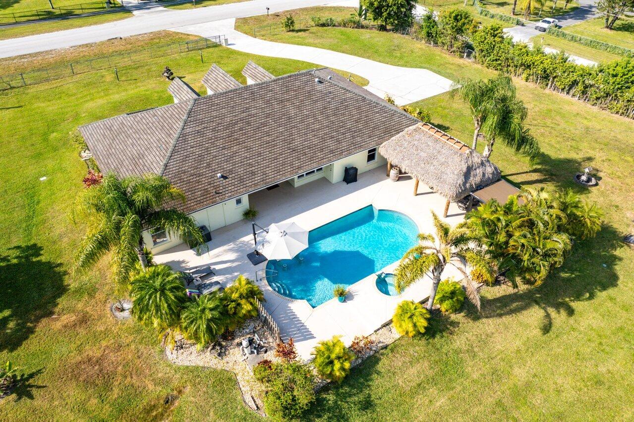 a view of swimming pool with a yard