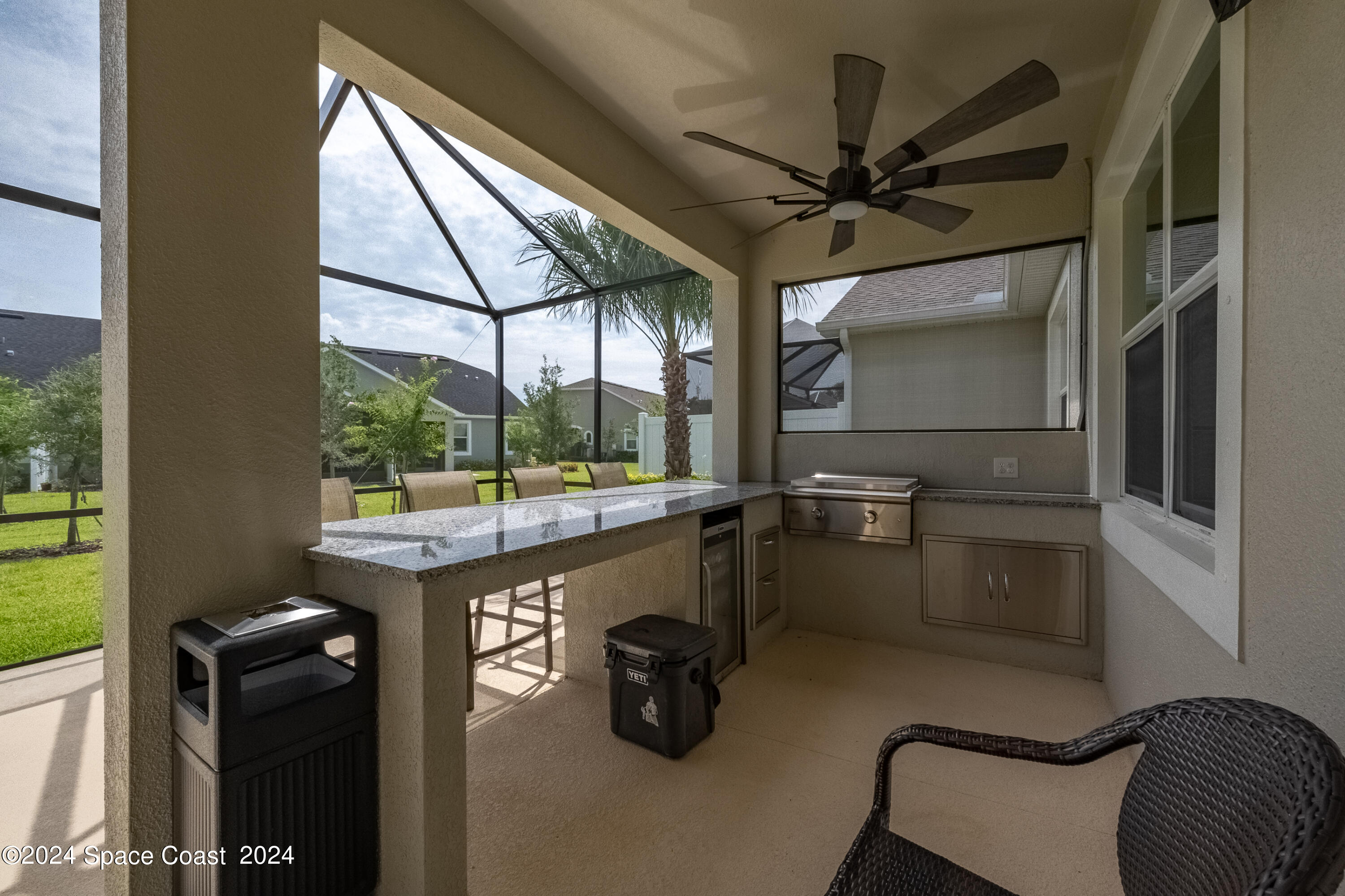 a room with gym equipment and a large window