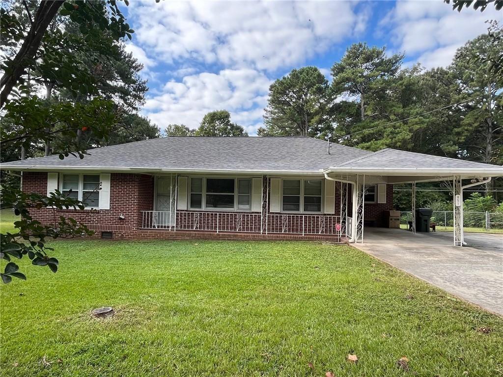 a front view of a house with a garden and porch