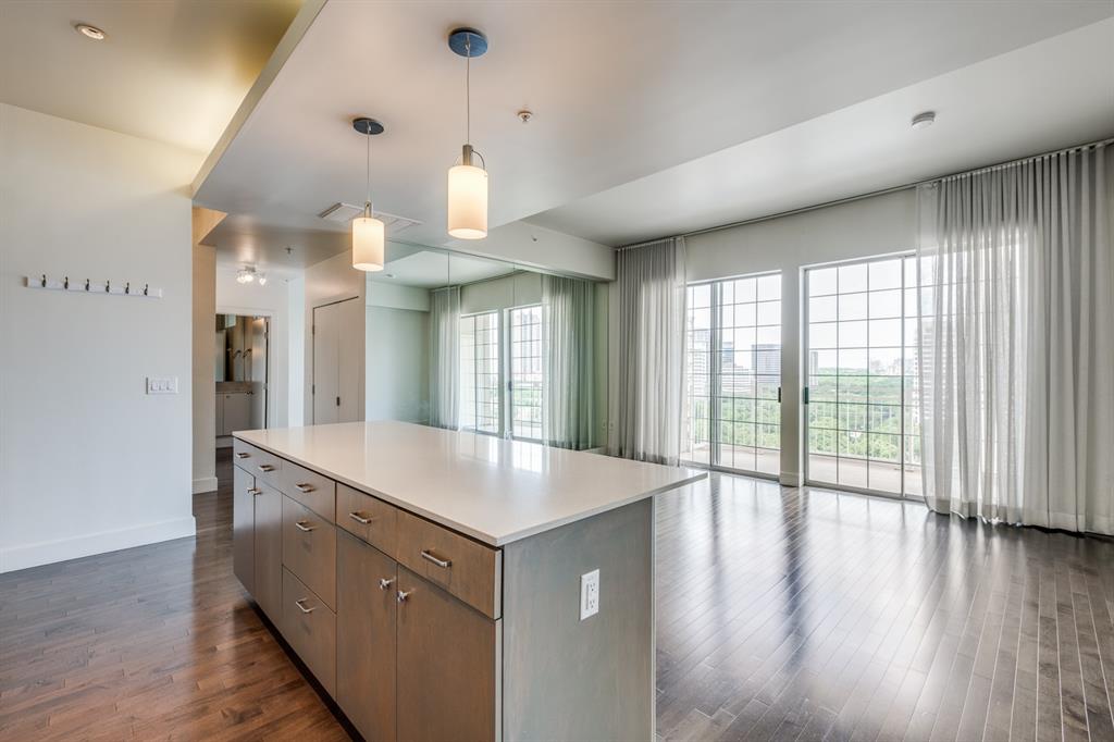 a view of a kitchen cabinets and wooden floor