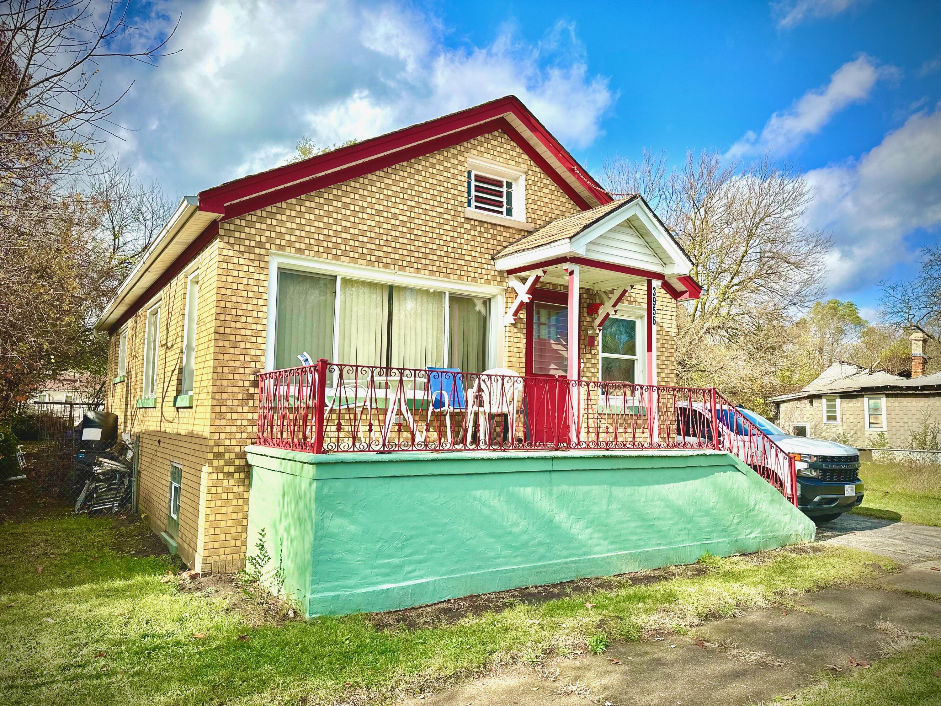 a front view of a house with garden