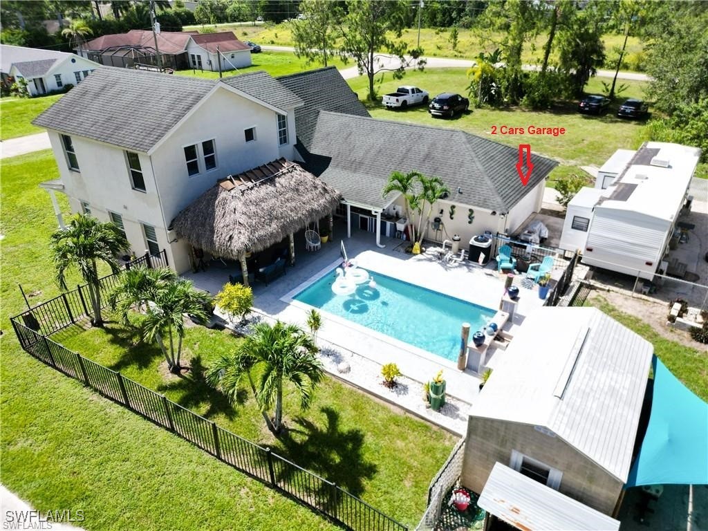 an aerial view of a house with garden space and street view