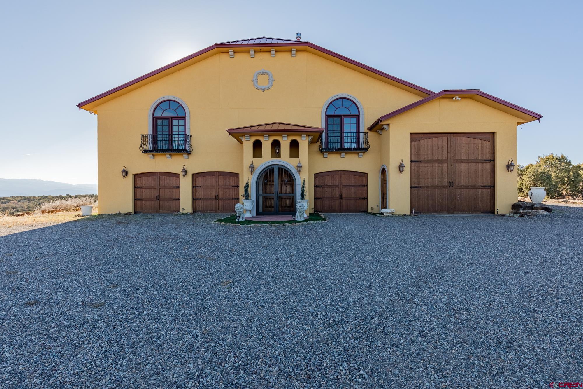 a view of a house with backyard and a yard