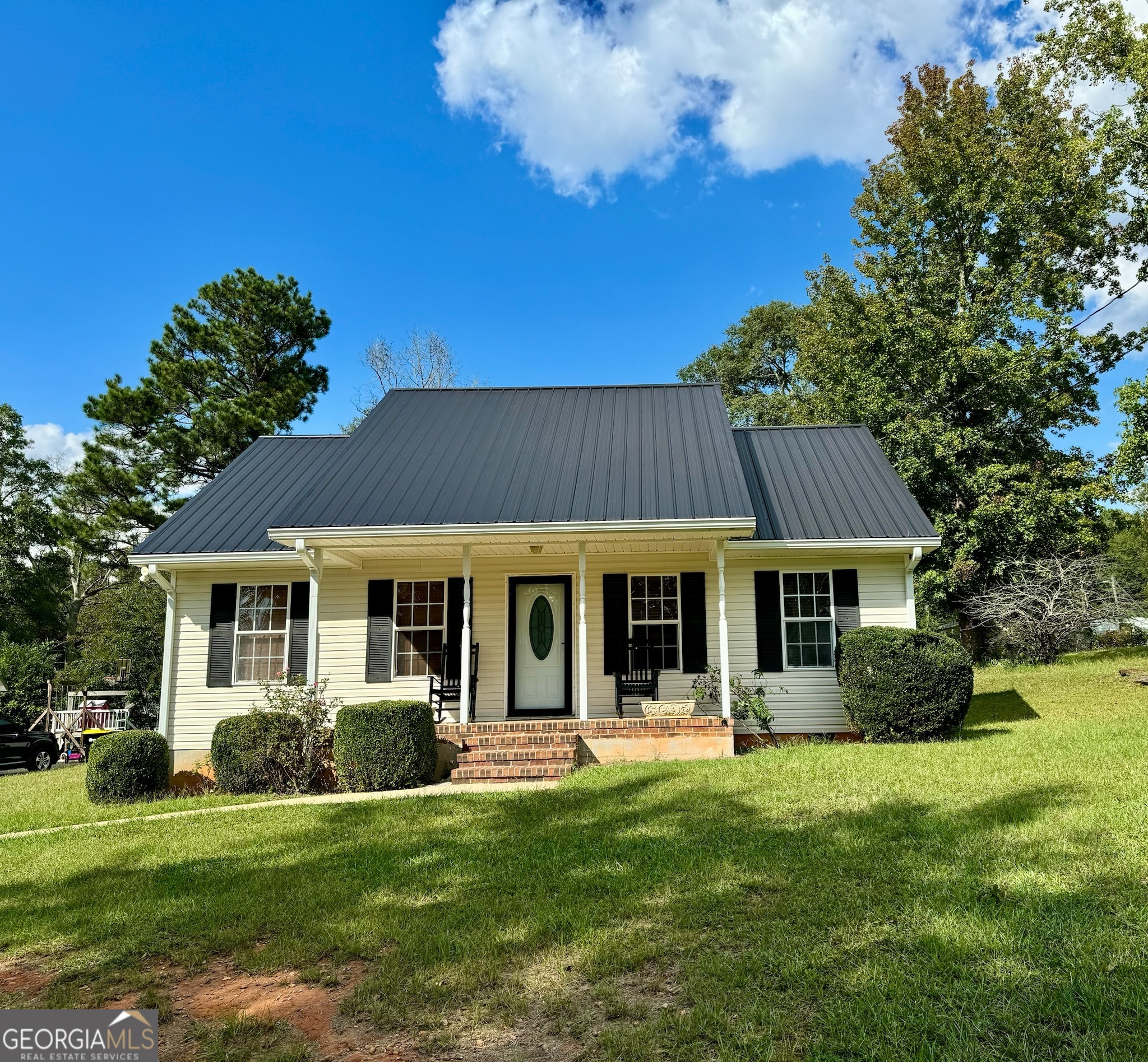 a front view of a house with a yard