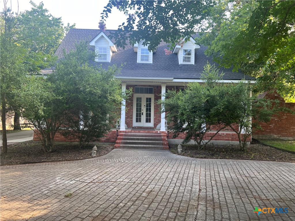 a view of house with yard