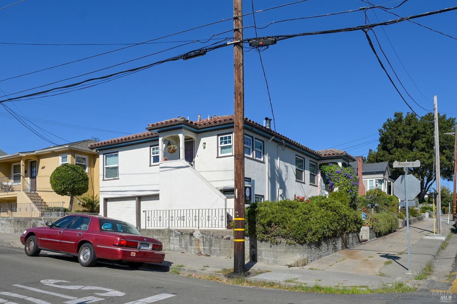 a view of a car parked front of a house