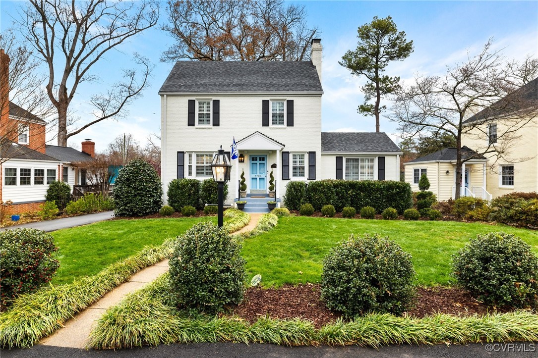 a front view of a house with a yard