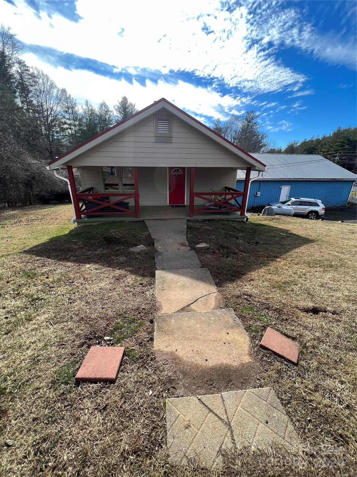 a front view of a house with yard