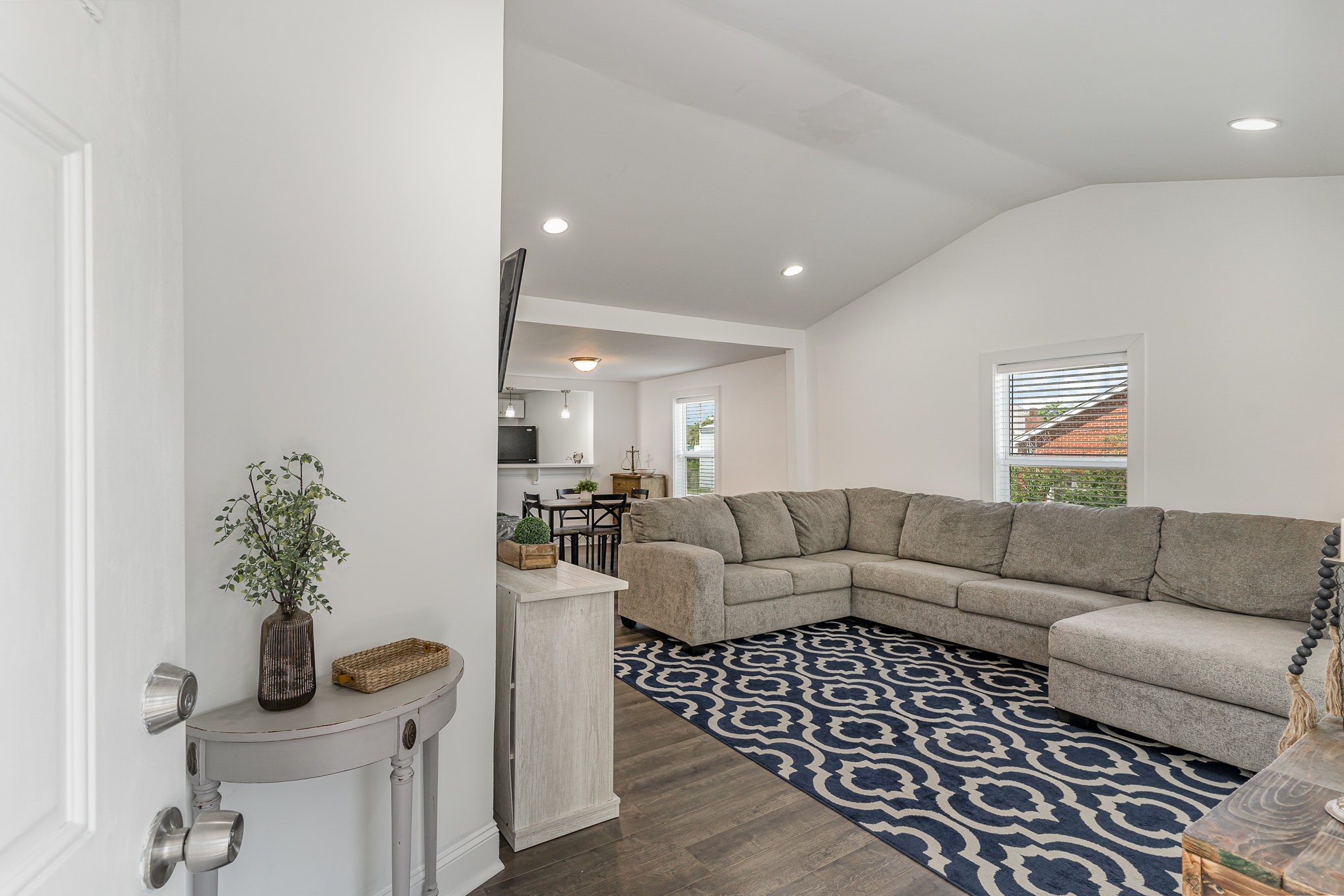 Notice the vaulted ceiling in the living room making it feel spacious