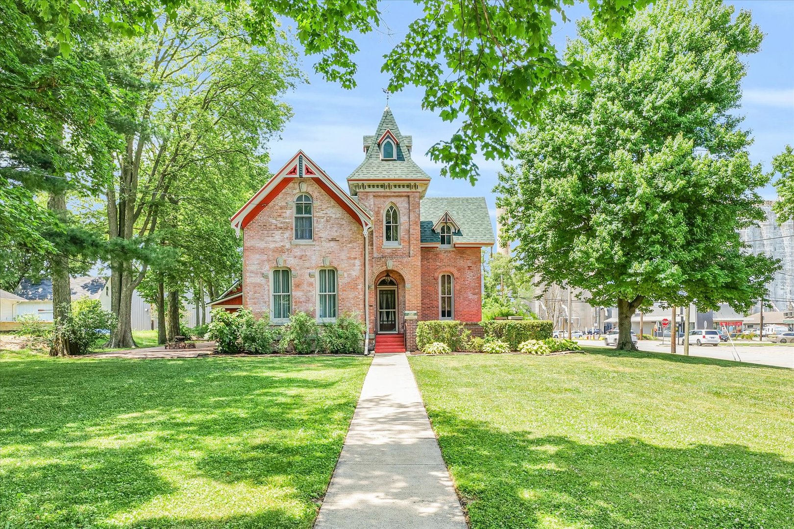 a front view of house with yard and green space