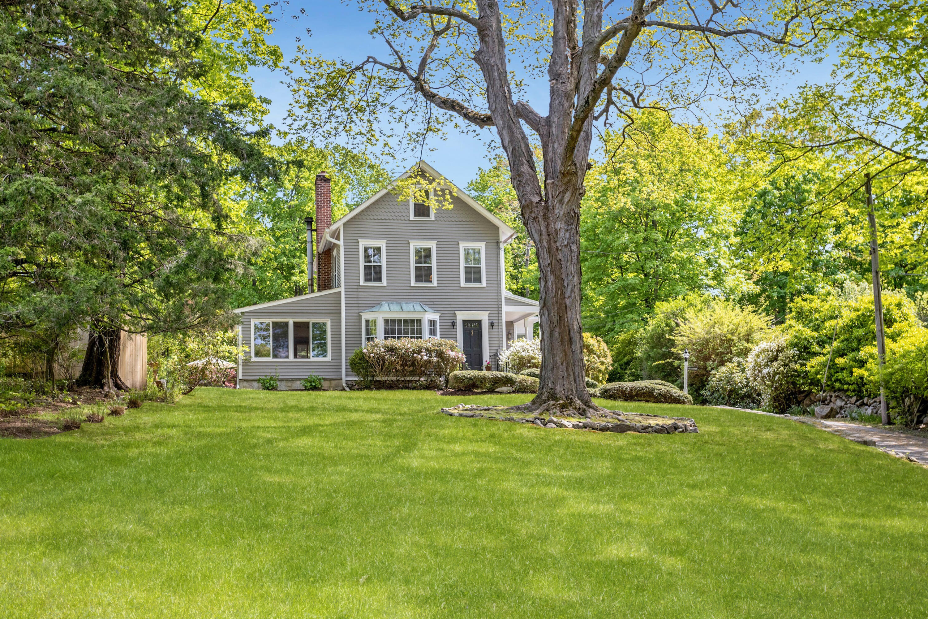 a front view of a house with garden