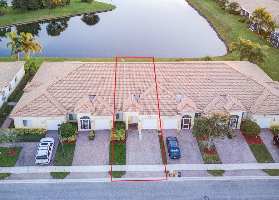 an aerial view of houses with yard