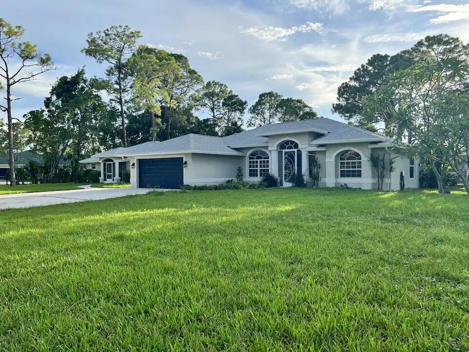 a view of a house with a yard