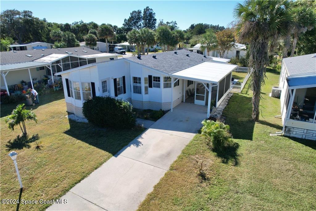 a aerial view of a house with a yard