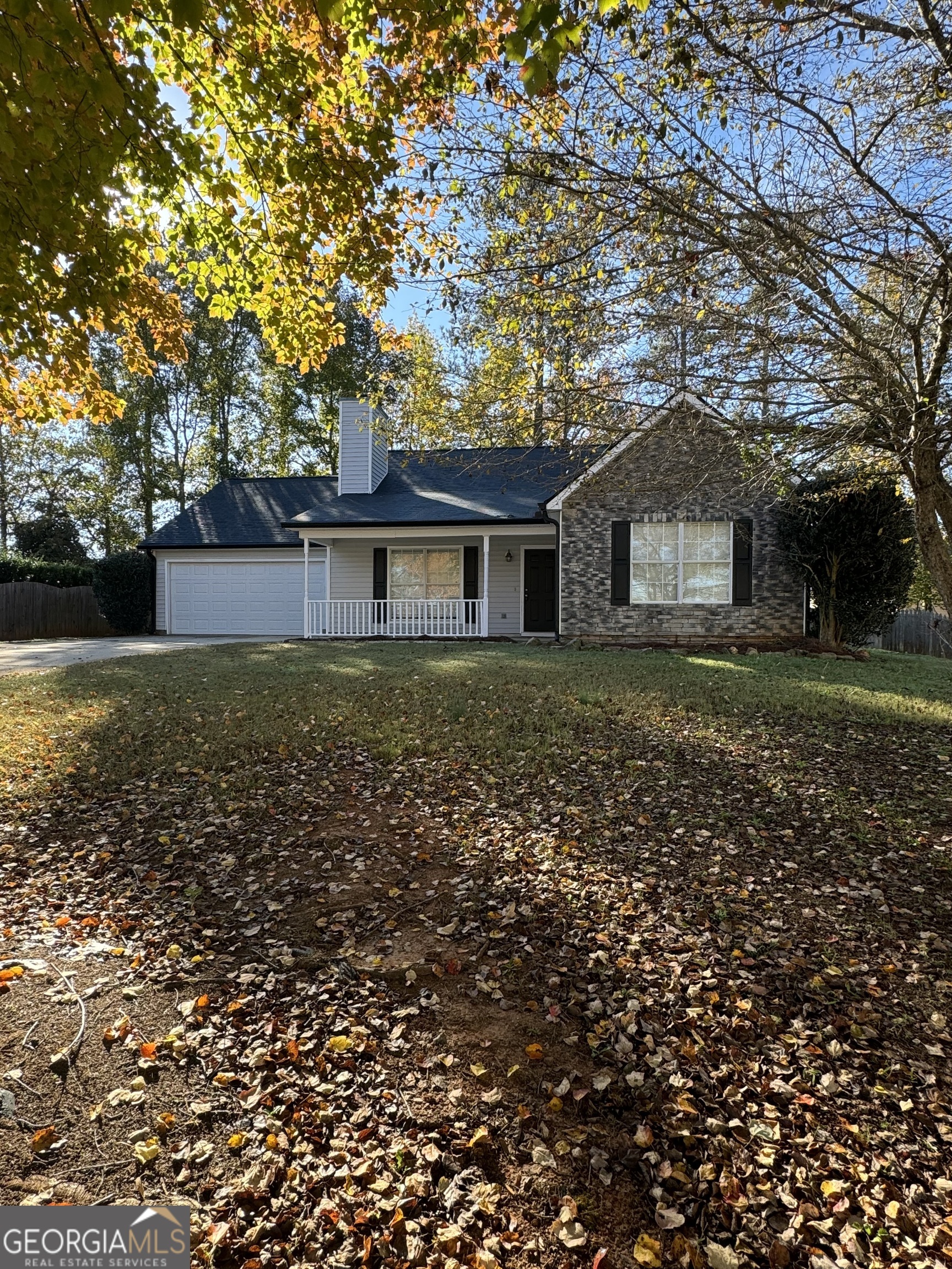 front view of a house with a yard