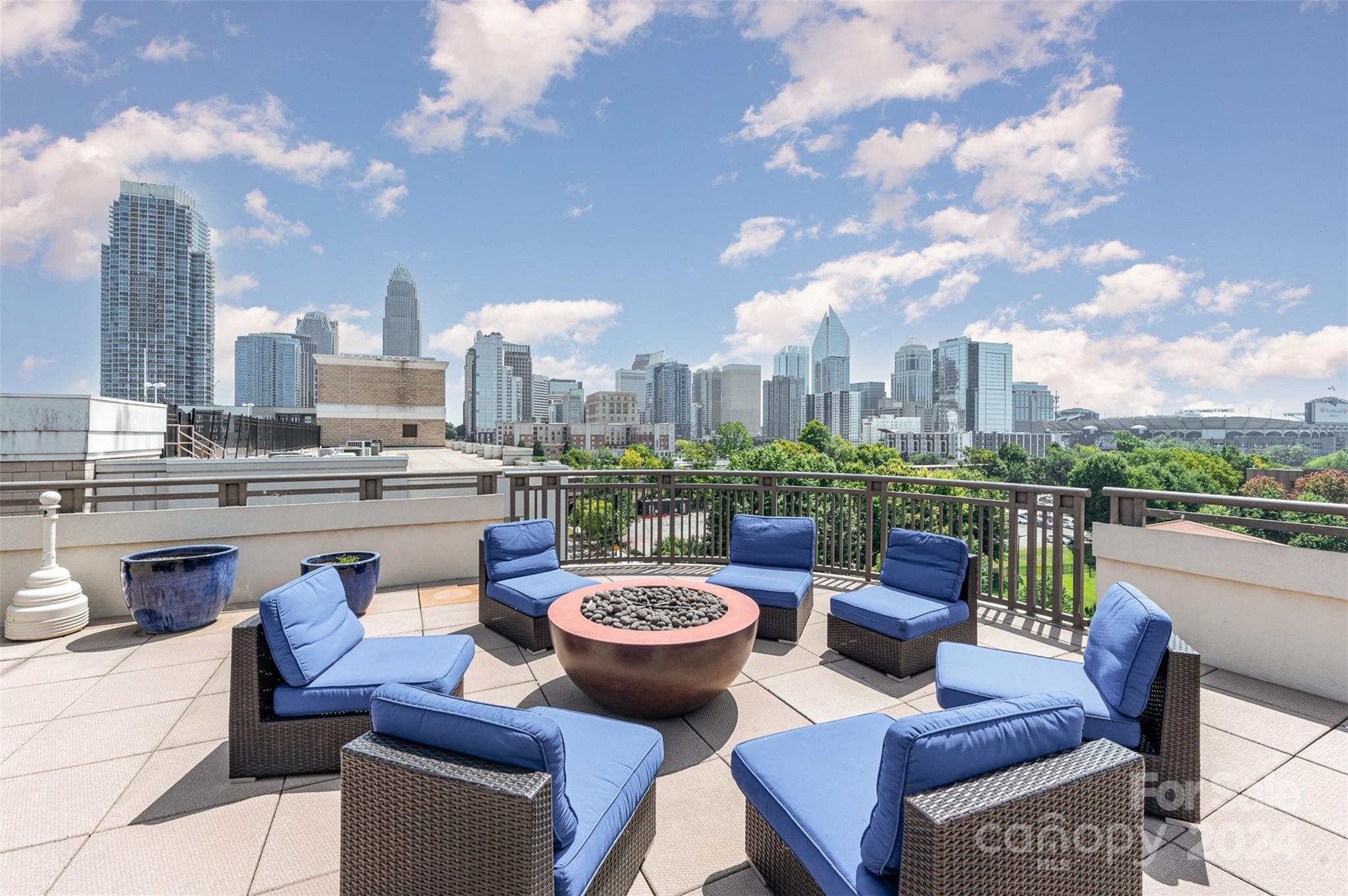 a table and chairs with the view of city