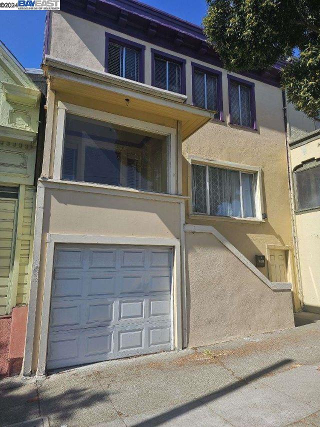 a front view of a house with a garage