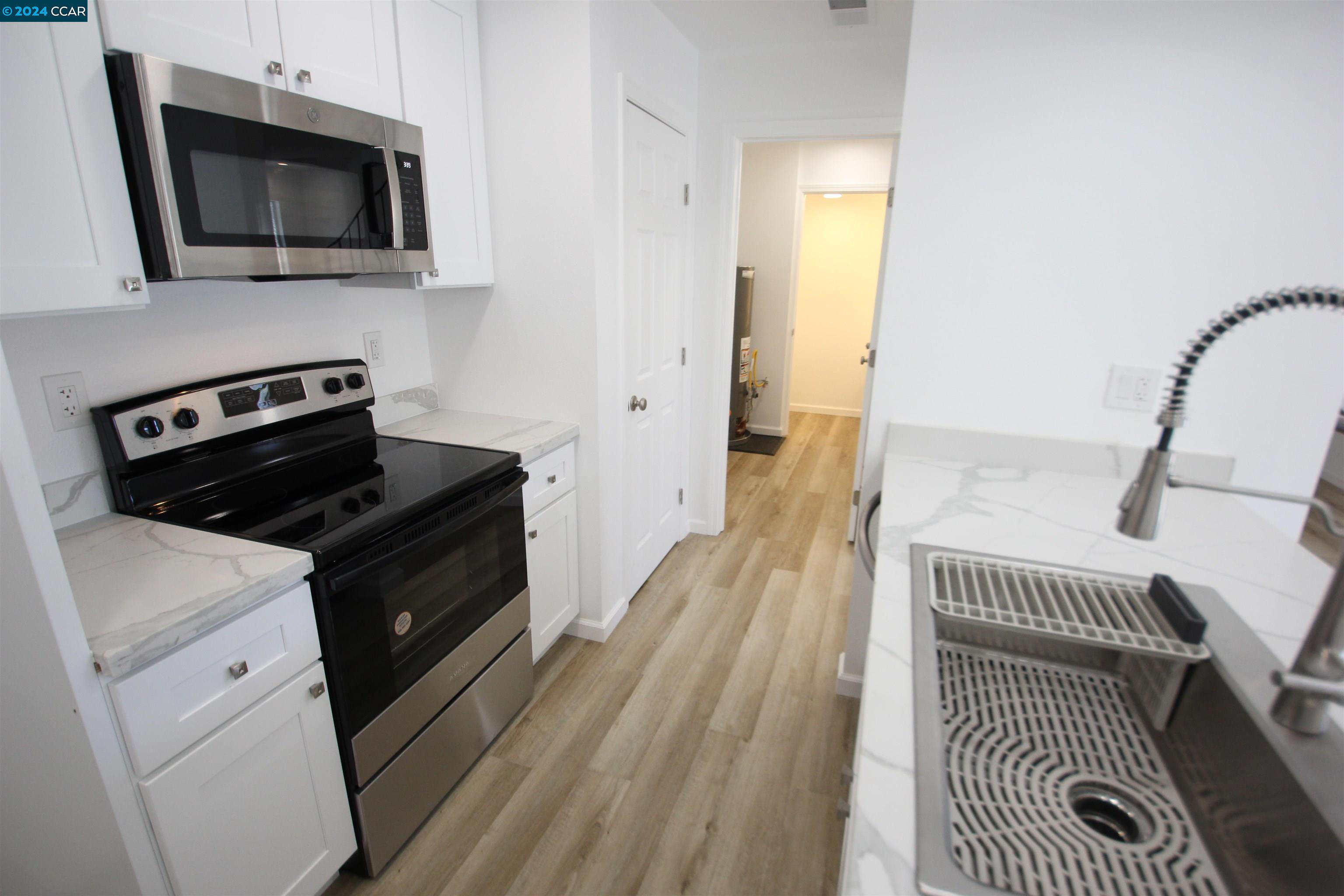 a kitchen with a stove and a microwave