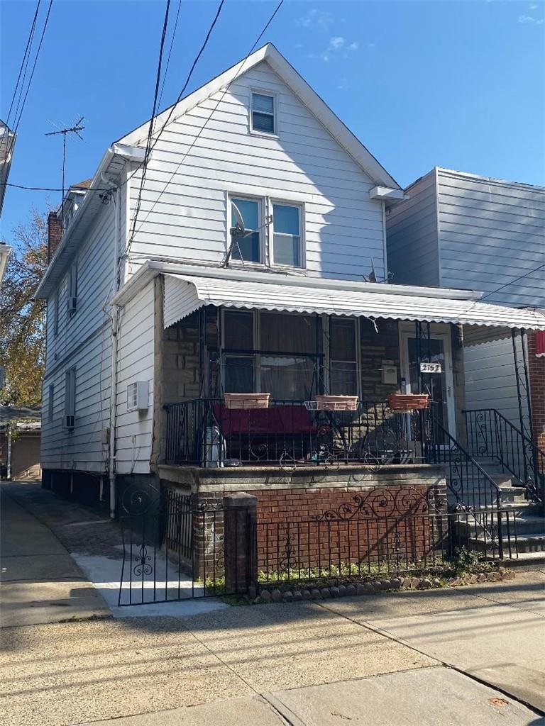 View of front of house with covered porch