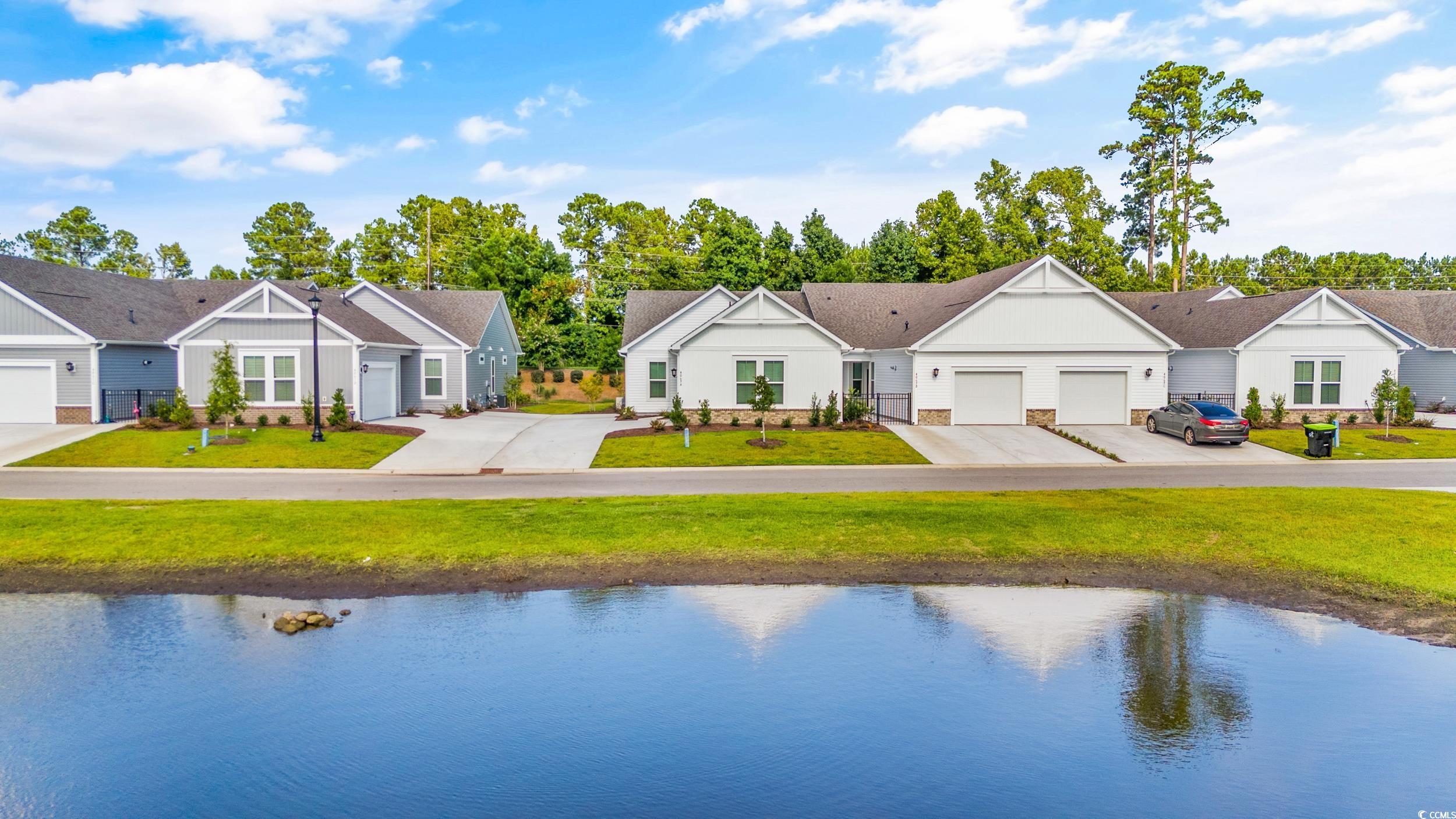 Exterior space featuring a yard and a water view