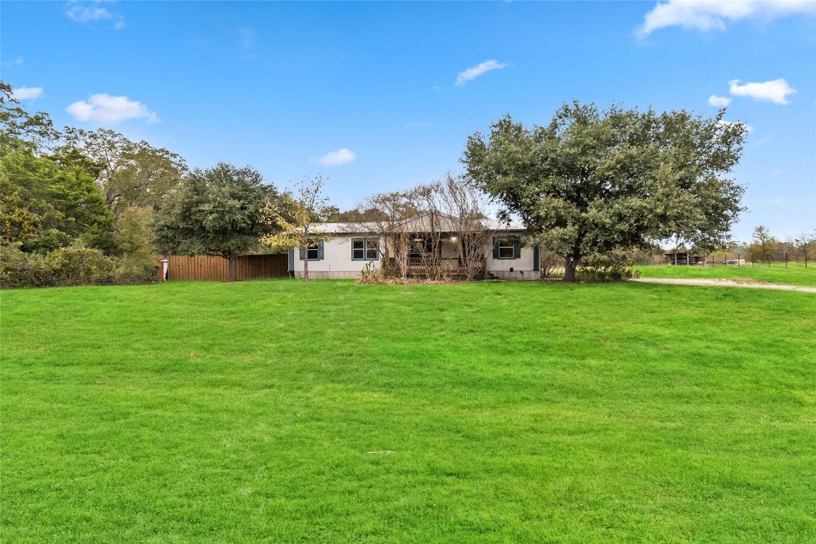 a view of a house with a big yard