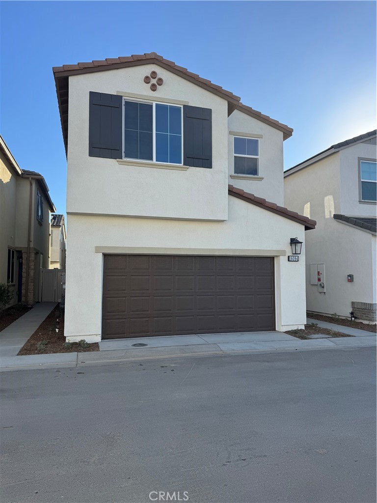 a front view of a house with a garage