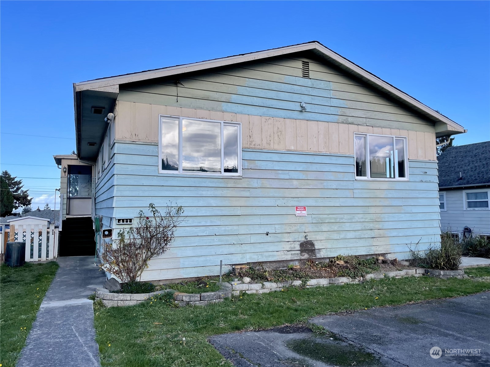 a front view of a house with garden